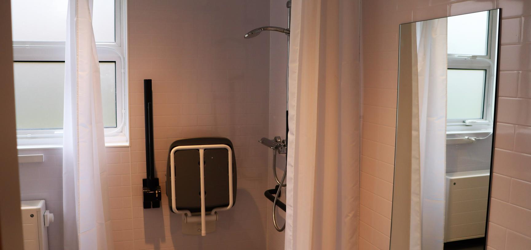 accessible bathroom including shower seat