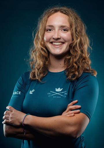 Lilli Freischem posing formally, wearing an Oxford University Boat Club rowing top ahead of competing for Oxford in The Boat Race.