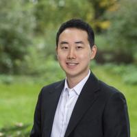 A smartly dressed man of East Asian heritage