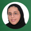 A green background with a circular frame superimposed. Inside is a headshot of a young woman in a black hijab and circular glasses.